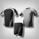 A silver grey soccer jersey with thick white lining along the shoulder to the under arm with black underneath the biceps and along the hip going downward from the sides. A black soccer jersey with thick white lining along the shoulder to the under arm with silver grey underneath the biceps and along the hip going downward from the sides. One black short with silver grey lining.